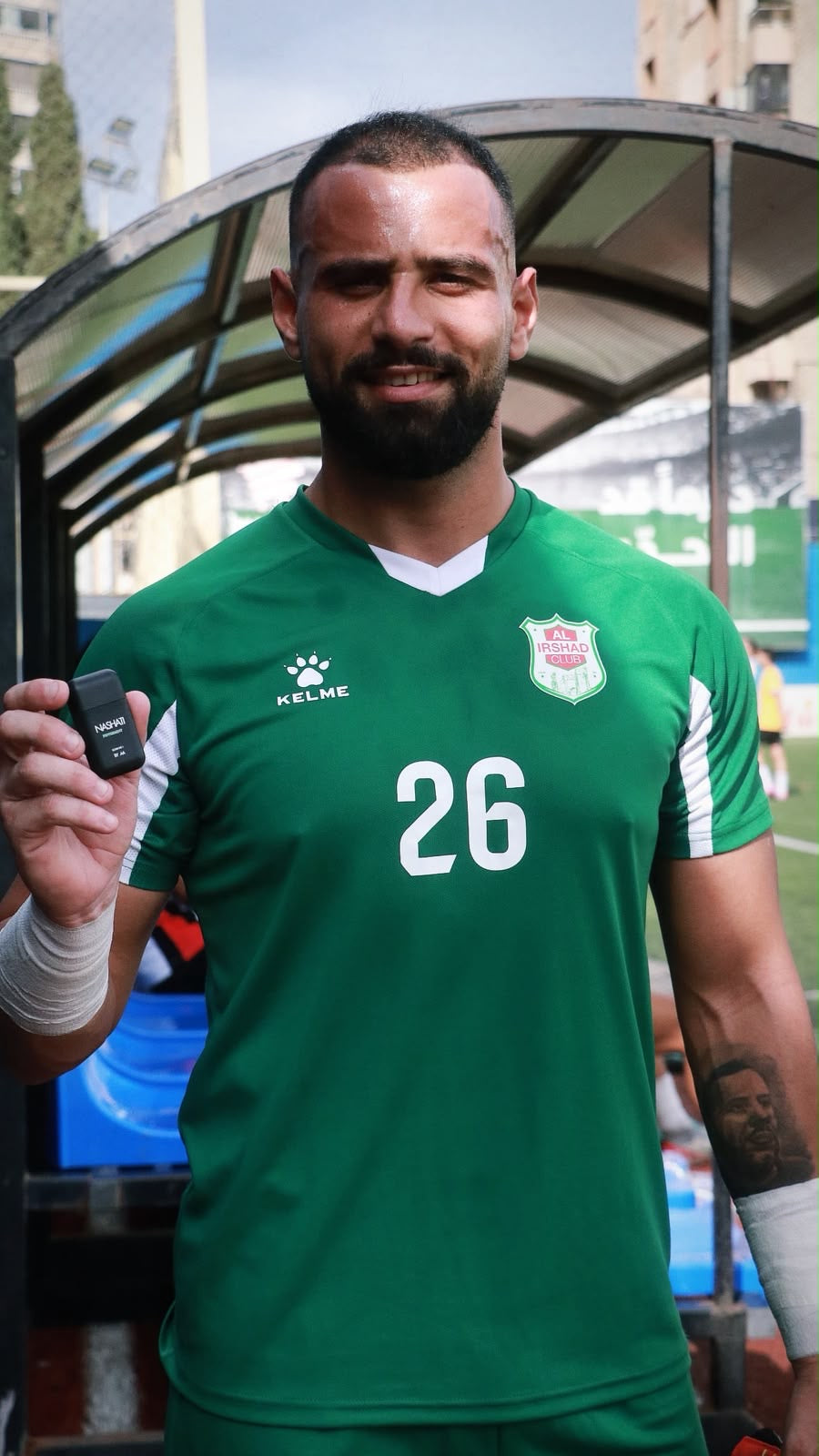 Ali Hajj Hassan of Al Irshad Club holding a Nashati inhaler